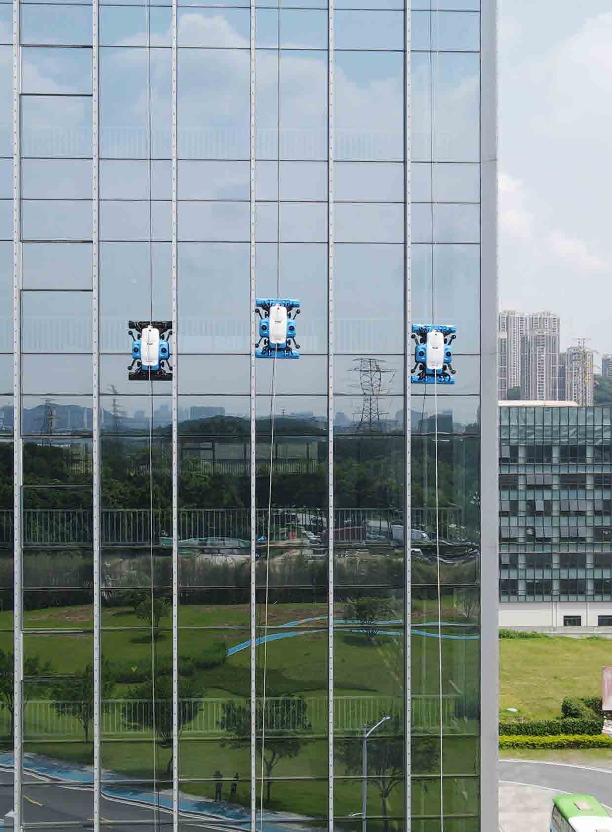 Curtain wall cleaning robots on a glass facade